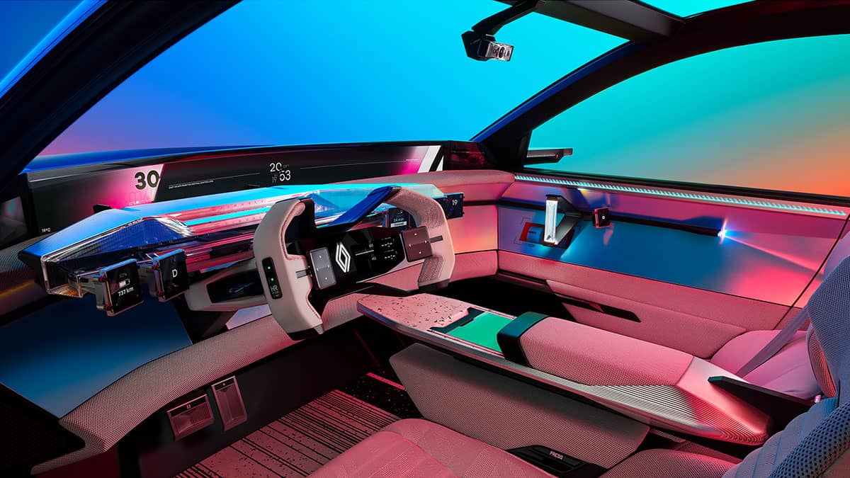 מבט על תא הנהג של רכב הקונספט Scenic Vision על רקע תאורה צבעונית